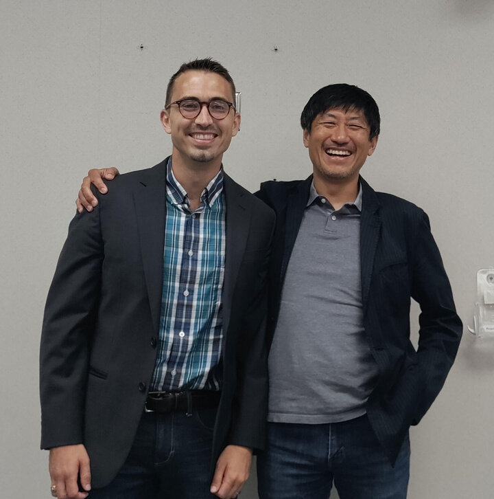 Two men after a dissertation defense.